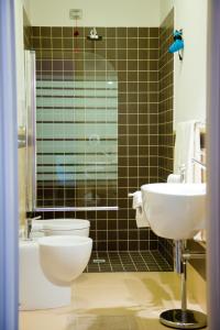 a bathroom with a toilet and a sink at Residence Coccinella in Torre Melissa