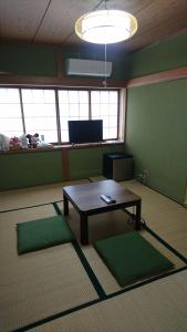 a room with a coffee table in a room at Toride - House / Vacation STAY 4015 in Toride