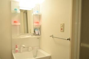 a white bathroom with a sink and a mirror at Park Hills East 23A / Vacation STAY 4384 in Sapporo