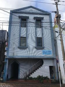 a building with a staircase in front of it at Hirata Building 3F / Vacation STAY 4269 in Goto