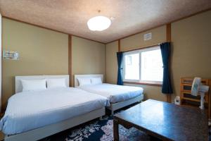 En eller flere senge i et værelse på ArcDream / Vacation STAY 4155