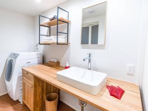 a bathroom with a sink and a washing machine at Rakuten STAY HOUSE x WILL STYLE Takasaki 104 in Takasaki +24 photos