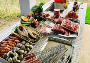 a buffet with different types of food on a table at Private - Villa - tsubasa- Vacation STAY 4192 in Kimitsu +21 photos