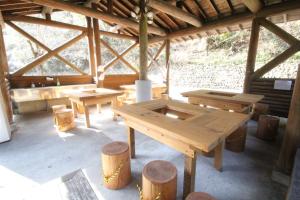 a wooden table and benches in a cabin at Takaoka-gun - Bungalow / Vacation STAY 33199 in Funato