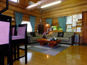 a living room with a couch and a table at Kameda-gun - Cottage / Vacation STAY 34923 in Nanae