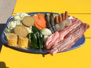 a plate of different types of food on a yellow table at Kunigami-gun - House - Vacation STAY 78177v in Higashi