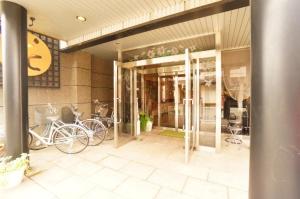 a building with two bikes parked outside of it at Takayama - House / Vacation STAY 44324 in Takayama