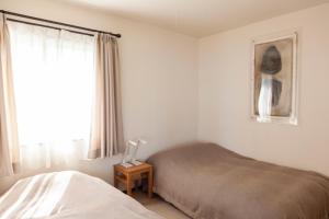 a bedroom with two beds and a window at Yoichi-gun - House / Vacation STAY 43683 in Yoichi