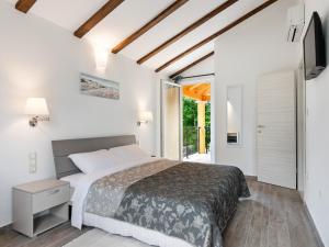 a bedroom with a bed and a sliding glass door at Holiday Home in Buzet with Terrace in Buzet