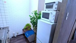 Cuisine ou kitchenette dans l'établissement Sejour Misono - Vacation STAY 15400