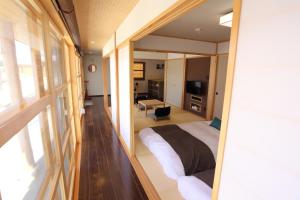 Postel nebo postele na pokoji v ubytování Tabi no teitaku Okinawa Nakijin HOMANN CONCEPTPT / Vacation STAY 45507