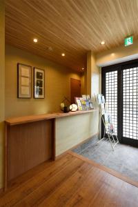a lobby with a reception desk in a building at Nagoya - House / Vacation STAY 47242 in Nagoya