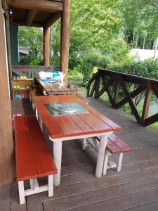 a wooden picnic table and benches on a deck at Ryoshuku Lassi / Vacation STAY 47925 in Koga +23 photos