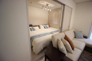 Postel nebo postele na pokoji v ubytování HOPE VILLA Onna-son - Vacation STAY 52857