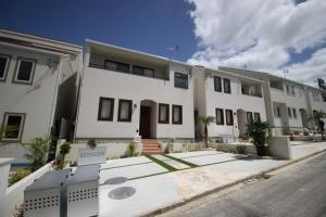 a large white building on the side of a street at HOPE VILLA Onna-son - Vacation STAY 52848 in Inbu