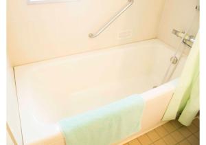 a bathroom with a bath tub with a towel on it at Shozu-gun - House / Vacation STAY 53734 in Tonosho