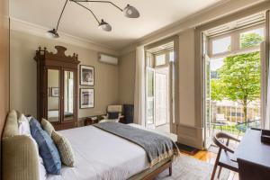 Katil atau katil-katil dalam bilik di Gallery Townhouse & Home
