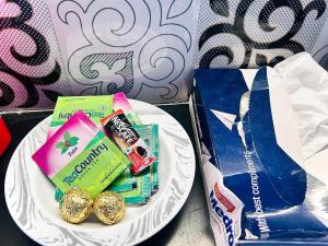a white plate with some food on top at SkyVista - City View Apartment  +14 photos