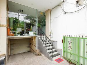 a building with a staircase in front of a store at Mi Linh Hotel in Ho Chi Minh City