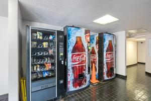 two soda machines in a room with soda bottles at 01 FREE Parking 10 min beach 2br-Waikiki Ala Moana in Honolulu