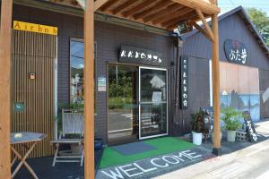 a store with a green floor in front of a building at Amakusa - House / Vacation STAY 5321 in Amakusa