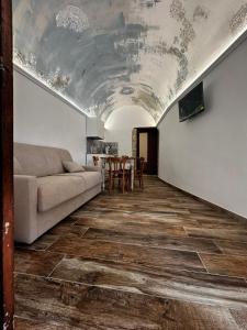 a living room with a couch and a table at Dimora San Valentino in Vico del Gargano