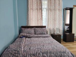 En eller flere senge i et værelse på Lake View Homestay