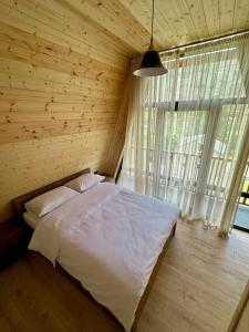 Postel nebo postele na pokoji v ubytování Dizak Hills