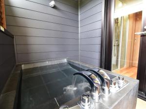 a kitchen sink with a faucet next to a window at Rakuten STAY MOTEL Kujukurihama Katakai 102 1LDK with BBQ terrace pet allowed in Kujukuri