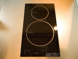 Bild einer Fernbedienung an einer Wand in der Unterkunft Rakuten STAY MOTEL Kujukurihama Katakai 203 1LDK with BBQ terrace in Kujukuri