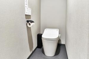 a small bathroom with a toilet in a stall at Rakuten STAY HOUSE Kisarazu in Kisarazu +42 photos