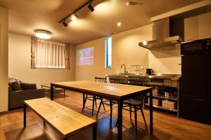 a kitchen with a table and chairs in a room at Rakuten STAY HOUSE Kisarazu in Kisarazu
