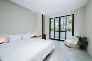 Ένα ή περισσότερα κρεβάτια σε δωμάτιο στο Grace Garden Coffee Homestay