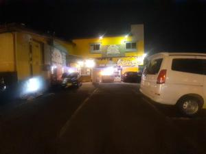 a white van parked in front of a building at night at Hamburger restaurant Big foot / Vacation STAY 6626 in Hachinohe