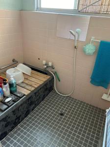 a bathroom with a sink and a shower at shiokaze guest house / Vacation STAY 6794 in Matsuyama