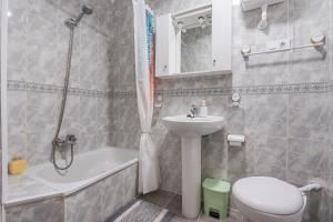 a bathroom with a sink and a toilet and a shower at Alicia's House in Granada +21 photos