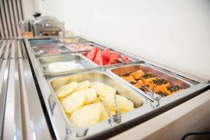 a buffet line with many different types of food at Italian Palace Hotel in Palmas