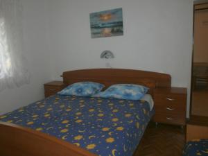 Postel nebo postele na pokoji v ubytování Apartments Gorenjka