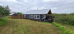 a small house on top of a hill at Holiday home on The Golden Circle Iceland in Selfoss