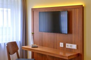 TV a/nebo společenská místnost v ubytování Hotel Apfelbaum