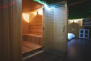 a bathroom with a sauna with a bed in it at مسكن خاص داخل عماره بمسبح in Taif