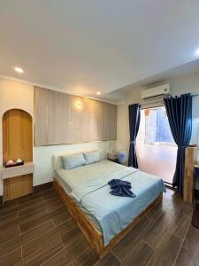 a bedroom with a large bed in a room at Homestay The Sunset in Phan Thiet +55 photos