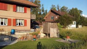 a house with a garden in front of it at Neumühleweg 19 in Lauperswil