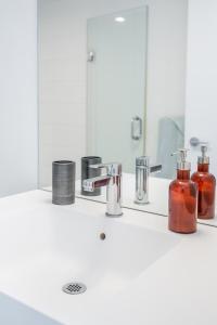 a bathroom counter with a sink and a mirror at Corner 2 Bedroom 2 Bathroom Condo Balcony Iceboat Terrace Downtown Toronto in Toronto +26 photos