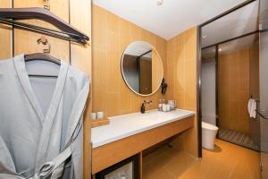 a bathroom with a sink and a mirror at JI Hotel Beijing South Railway Station Muxiyuan in Beijing
