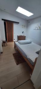 a bedroom with a large bed in a room at Gîte "Le Pacifique" in Esneux