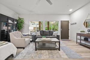a living room with a couch and a table at Tranquil Lake Oswego Luxury Studio in Lake Oswego
