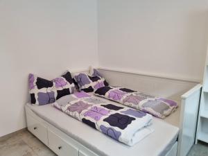 a white couch with three pillows on it at Alpine Hideaway in Arzl im Pitztal