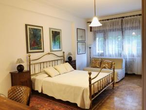 Ένα ή περισσότερα κρεβάτια σε δωμάτιο στο Casa Carlotta +54 φωτογραφίες