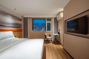 Postel nebo postele na pokoji v ubytování Urba Hotel Nanchang Bayi Square Wushang Shopping Center Branch